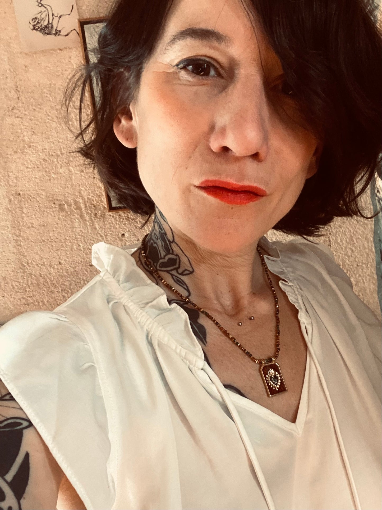 Collier amulette marron